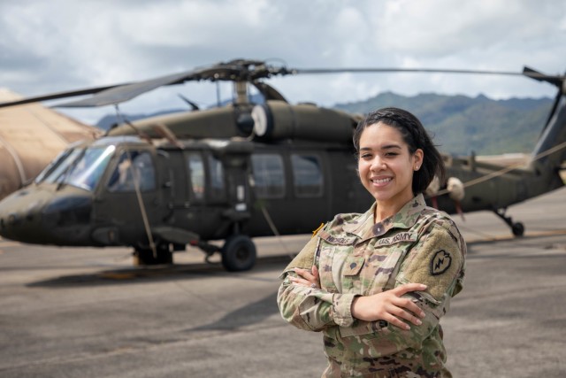 Spc. Kiala Nichols, an Aviation Operation Specialist (15P), assigned to 25th Combat Aviation Brigade, 25th Infantry Division at Wheeler Army Airfield, Hawaii, poses for a  photo in front of an UH-60 Blackhawk. Nichols has future dreams of becoming an UH-60 Blackhawk pilot.
(U.S. Army photo by Sgt. Sarah D. Sangster)