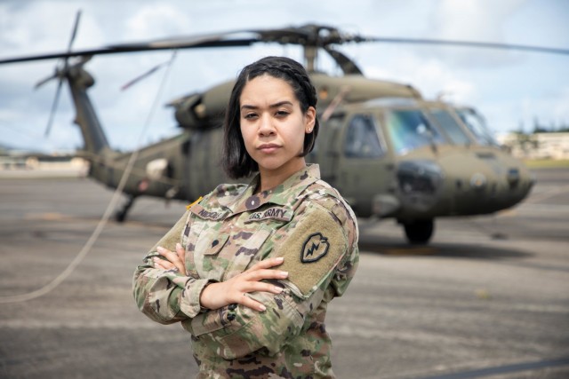 Spc. Kiala Nichols, an aviation operation specialist assigned to 25th Combat Aviation Brigade, 25th Infantry Division at Wheeler Army Airfield, Hawaii, poses for a photo in front of a UH-60 Black Hawk March 4, 2021. Nichols said she has dreams of...