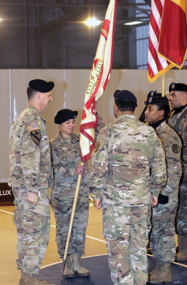 Command Sgt. Maj. Samara Pitre accepts the U.S. Army Garrison Benelux flag signaling her assumption of responsibility as the senior enlisted advisor to the garrison on Oct. 24, 2017, at Chièvres Air Base, Belgium. 