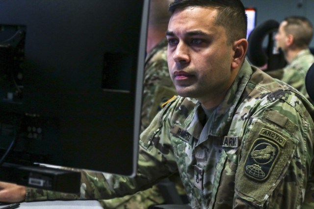 Staff Sgt. Yamil Ramirez-Lopez, a weapons operator with the 49th Missile Defense Battalion, Alaska Army National Guard, works in the Fire Direction Center at Fort Greely, Alaska. Soldiers from the 49th Missile Defense Battalion participated in...