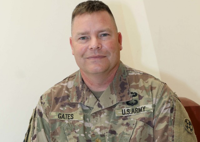 Army Reserve Maj. John Gates deployed to Camp Arifjan, Kuwait, with the 310th Sustainment Command (Expeditionary) in December 2020, roughly 30 years after he deployed to Saudi Arabi as a young military intelligence analyst private serving in the First Gulf War. Gates is the Support Operations Center battle major at the 1st Theater Sustainment Command's operational command post at the camp. (U.S. Army photo by Staff Sgt. Neil W. McCabe)