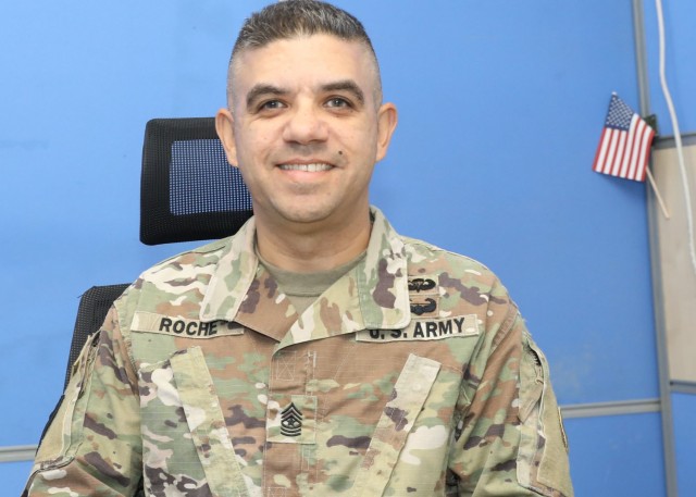 Army Reserve Sgt. Maj. Anibal Roche Jr., who is the chief signal noncommissioned officer for the G-6, or information systems and communications shop, at 1st Theater Sustainment Command's operational command post, Camp Arifjan, Kuwait, deployed to Saudi Arabia for the First Gulf War roughly 30 years ago. Roche, serving now with the 310th Sustainment Command (Expeditionary), said he still wears his gulf war combat patch from the since deactivated 2nd Corps Support Command. (U.S. Army photo by Staff Sgt. Neil W. McCabe)
