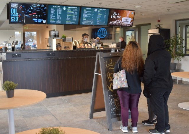CHIÈVRES, Belgium – Guests view what products are for sale at the newly opened Bene Brew Café and Pub at Chièvres Air Base, Belgium. The Bene Brew Café and Pub officially opened its doors March 11 during a ribbon-cutting ceremony with Tommy...