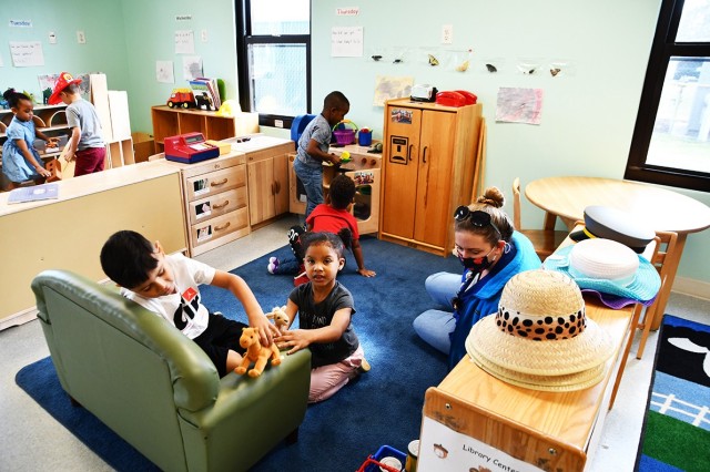 Faith Nietfeld, a teacher at CDC bldg 3349 watches over her students as they play.