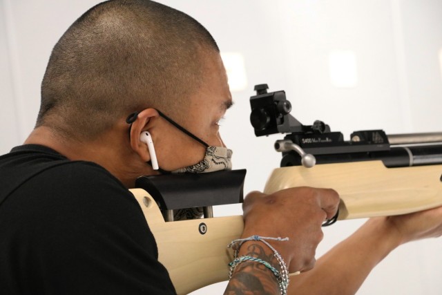 U.S. Army Staff Sgt. Gene Calantoc, Soldier Recovery Unit, Brooke Army Medical Center, takes careful aim during the Virtual Army Trials air rifle event at Cole High School, Fort Sam Houston, Texas, March 4, 2021. Calantoc and several other BAMC SRU Soldiers are vying for selection to Team Army to compete in the DoD Warrior Games in September.  (U.S. Army photo by Robert A. Whetstone)