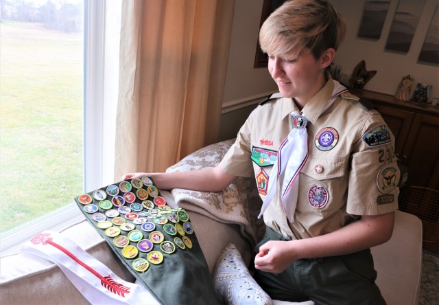 Miranda Zopfi, of Rineyville, Kentucky, shows off her many badges and accolades earned as a Boy Scout of America. She joins only about a thousand girls nationwide as the first female inaugural class of the rank of Eagle Scout.