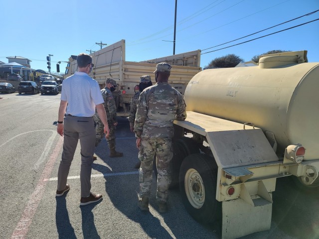 Troopers from Blacksmith Troop, Regimental Support Squadron, 3rd Cavalry Regiment work with members from the City of Harker Heights while providing water buffalo support during the winter storm that devastated Texas in February. (U.S. Army photo by Maj. Marion Jo Nederhoed)