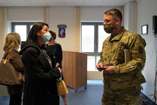 Angela Abernethy, spouse of U.S. Army Europe and Africa Command Sgt. Maj. Rob Abernethy, speaks to Col. E. Lee Bryan, commander of MEDDAC-Bavaria, about the Behavior Health program, March 11, 2021.