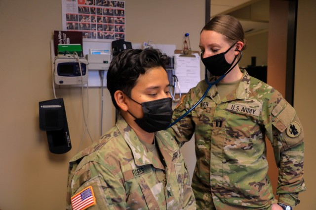 U.S. Army Capt. Heather A. Meier, physician assistant at U.S. Army South Headquarters and Headquarters Battalion, uses her stethoscope on Sgt. Jessenia J. Flores at U.S. Army South Headquarters on Joint Base San Antonio – Fort Sam Houston, Texas, March 8, 2021. Meier’s duties are to take care of soldier’s basic health care needs at Army South. (U.S. Army photo by Pfc. Joshua Taeckens)