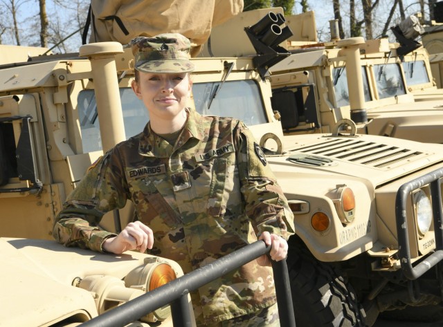 Oregon Army National Guard Sgt. Jessica Edwards, an Automated Logistical Specialist pauses for a photo with vehicles assigned to her unit, Salem, Ore., on March 12, 2021. Over the past year, Edwards has been tracking and insuring 821st Troop...