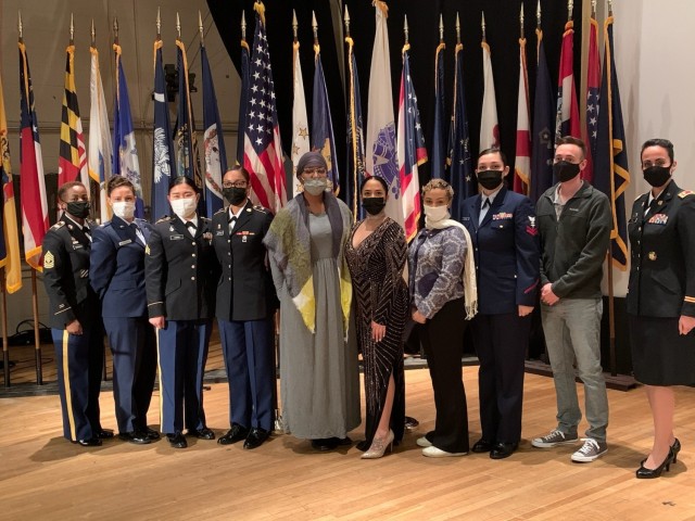 Fort Hamilton’s mission partner, Military Entrance Processing Station New York, hosts an event, Mar. 12, 2021, at the post theater on Fort Hamilton, N.Y.  The event tied in a walk through history, featuring military and civilian members donning attire from the era as they sang, read poetry, or shared testimonials of significant women.