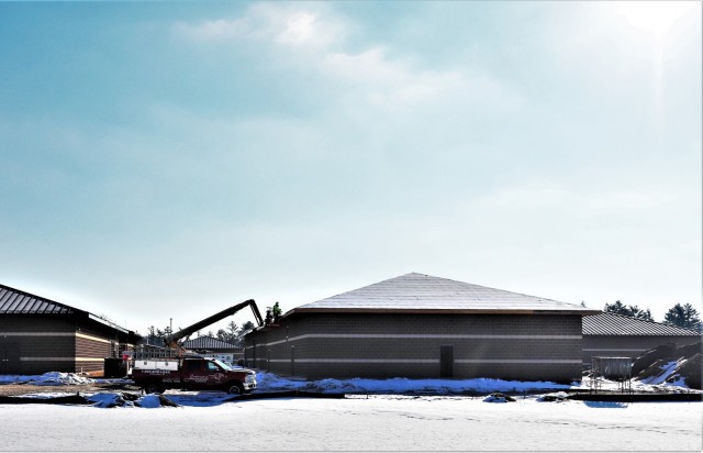 Work on a new simulations building is shown Feb. 25, 2021, in the 200 block of the cantonment area at Fort McCoy, Wis. The construction of this facility is by Contractor MDM Construction Supply of Rockford, Ill. This is the same contractor that has nearly completed five other buildings that began construction in 2019. Once all six new buildings are completed, the simulations training capabilities at Fort McCoy will be more centralized and offer more capability. The simulations training complex is managed by the Fort McCoy Directorate of Plans, Training, Mobilization and Security. The construction project is coordinated by the Fort McCoy Directorate of Public Works. (US. Army Photo by Scott T. Sturkol, Public Affairs Office, Fort McCoy, Wis.)