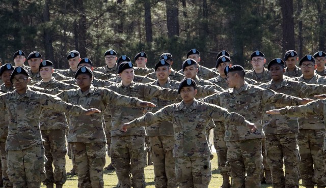 Pvt. Kenny Oliver (middle), a trainee with 1st Battalion, 34th Infantry Regiment, ensures he has the proper interval within his platoon moments before the unit's graduation ceremony March 11 at Hilton Field on Fort Jackson. Oliver, who will be...