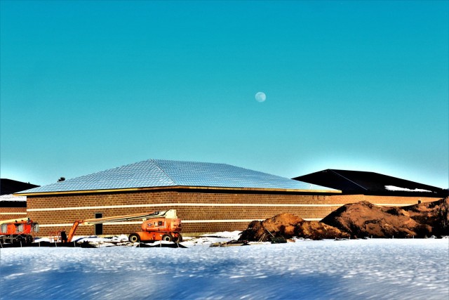 Work on a new simulations building is shown Feb. 25, 2021, in the 200 block of the cantonment area at Fort McCoy, Wis. The construction of this facility is by Contractor MDM Construction Supply of Rockford, Ill. This is the same contractor that has nearly completed five other buildings that began construction in 2019. Once all six new buildings are completed, the simulations training capabilities at Fort McCoy will be more centralized and offer more capability. The simulations training complex is managed by the Fort McCoy Directorate of Plans, Training, Mobilization and Security. The construction project is coordinated by the Fort McCoy Directorate of Public Works. (US. Army Photo by Scott T. Sturkol, Public Affairs Office, Fort McCoy, Wis.)