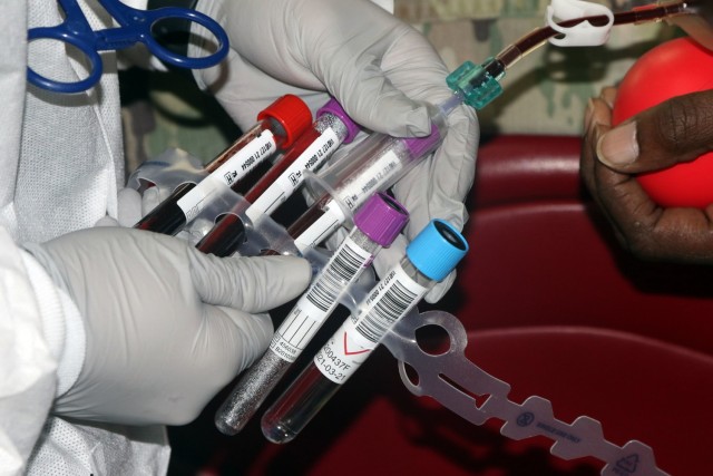 A laboratory technician with the Armed Services Blood Program draws blood from a donor assigned to 5th Armored Brigade, First Army Division West, during a blood drive event on Fort Bliss, Texas, May 16, 2021. Blood drive events are important...