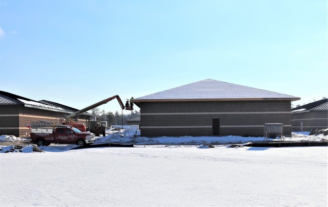 Work on a new simulations building is shown Feb. 25, 2021, in the 200 block of the cantonment area at Fort McCoy, Wis. The construction of this facility is by Contractor MDM Construction Supply of Rockford, Ill. This is the same contractor that has nearly completed five other buildings that began construction in 2019. Once all six new buildings are completed, the simulations training capabilities at Fort McCoy will be more centralized and offer more capability. The simulations training complex is managed by the Fort McCoy Directorate of Plans, Training, Mobilization and Security. The construction project is coordinated by the Fort McCoy Directorate of Public Works. (US. Army Photo by Scott T. Sturkol, Public Affairs Office, Fort McCoy, Wis.)