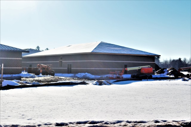 Work on a new simulations building is shown Feb. 26, 2021, in the 200 block of the cantonment area at Fort McCoy, Wis. The construction of this facility is by Contractor MDM Construction Supply of Rockford, Ill. This is the same contractor that has nearly completed five other buildings that began construction in 2019. Once all six new buildings are completed, the simulations training capabilities at Fort McCoy will be more centralized and offer more capability. The simulations training complex is managed by the Fort McCoy Directorate of Plans, Training, Mobilization and Security. The construction project is coordinated by the Fort McCoy Directorate of Public Works. (US. Army Photo by Scott T. Sturkol, Public Affairs Office, Fort McCoy, Wis.)