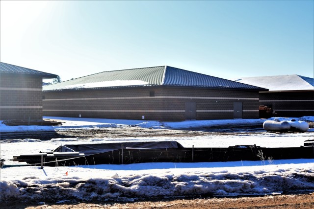 Work on a new simulations building is shown Feb. 26, 2021, in the 200 block of the cantonment area at Fort McCoy, Wis. The construction of this facility is by Contractor MDM Construction Supply of Rockford, Ill. This is the same contractor that has nearly completed five other buildings that began construction in 2019. Once all six new buildings are completed, the simulations training capabilities at Fort McCoy will be more centralized and offer more capability. The simulations training complex is managed by the Fort McCoy Directorate of Plans, Training, Mobilization and Security. The construction project is coordinated by the Fort McCoy Directorate of Public Works. (US. Army Photo by Scott T. Sturkol, Public Affairs Office, Fort McCoy, Wis.)