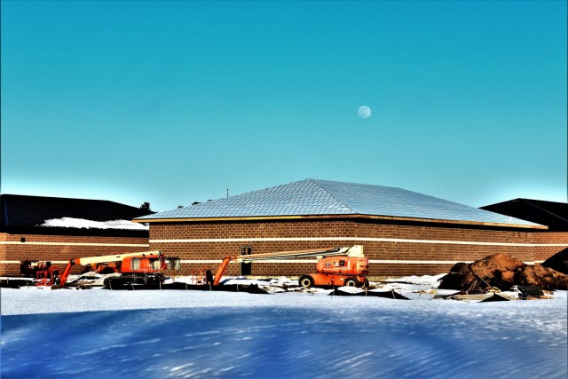 Work on a new simulations building is shown Feb. 25, 2021, in the 200 block of the cantonment area at Fort McCoy, Wis. The construction of this facility is by Contractor MDM Construction Supply of Rockford, Ill. This is the same contractor that has nearly completed five other buildings that began construction in 2019. Once all six new buildings are completed, the simulations training capabilities at Fort McCoy will be more centralized and offer more capability. The simulations training complex is managed by the Fort McCoy Directorate of Plans, Training, Mobilization and Security. The construction project is coordinated by the Fort McCoy Directorate of Public Works. (US. Army Photo by Scott T. Sturkol, Public Affairs Office, Fort McCoy, Wis.)