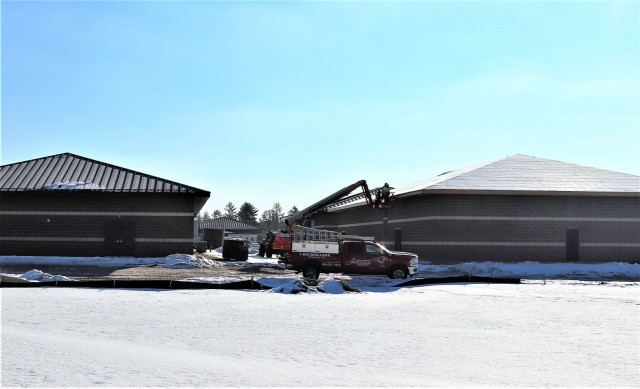 Work on a new simulations building is shown Feb. 25, 2021, in the 200 block of the cantonment area at Fort McCoy, Wis. The construction of this facility is by Contractor MDM Construction Supply of Rockford, Ill. This is the same contractor that has nearly completed five other buildings that began construction in 2019. Once all six new buildings are completed, the simulations training capabilities at Fort McCoy will be more centralized and offer more capability. The simulations training complex is managed by the Fort McCoy Directorate of Plans, Training, Mobilization and Security. The construction project is coordinated by the Fort McCoy Directorate of Public Works. (US. Army Photo by Scott T. Sturkol, Public Affairs Office, Fort McCoy, Wis.)