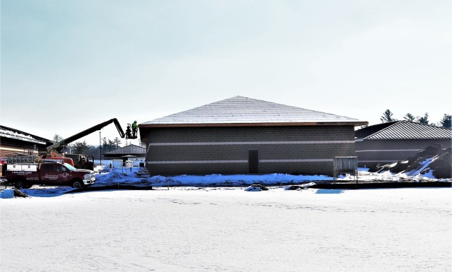 Work on a new simulations building is shown Feb. 25, 2021, in the 200 block of the cantonment area at Fort McCoy, Wis. The construction of this facility is by Contractor MDM Construction Supply of Rockford, Ill. This is the same contractor that has nearly completed five other buildings that began construction in 2019. Once all six new buildings are completed, the simulations training capabilities at Fort McCoy will be more centralized and offer more capability. The simulations training complex is managed by the Fort McCoy Directorate of Plans, Training, Mobilization and Security. The construction project is coordinated by the Fort McCoy Directorate of Public Works. (US. Army Photo by Scott T. Sturkol, Public Affairs Office, Fort McCoy, Wis.)