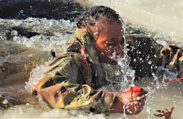 A Fort McCoy Cold-Weather Operations Course (CWOC) Class 21-04 student participates in cold-water immersion training Feb. 26, 2021, at Big Sandy Lake on South Post at Fort McCoy, Wis. CWOC students are trained on a variety of cold-weather...