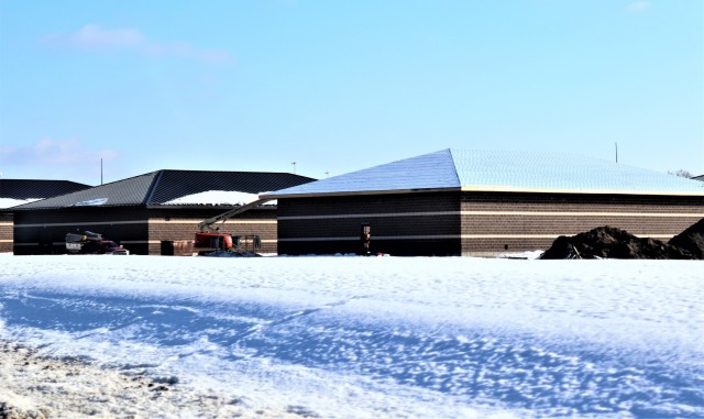 Work on a new simulations building is shown Feb. 25, 2021, in the 200 block of the cantonment area at Fort McCoy, Wis. The construction of this facility is by Contractor MDM Construction Supply of Rockford, Ill. This is the same contractor that has nearly completed five other buildings that began construction in 2019. Once all six new buildings are completed, the simulations training capabilities at Fort McCoy will be more centralized and offer more capability. The simulations training complex is managed by the Fort McCoy Directorate of Plans, Training, Mobilization and Security. The construction project is coordinated by the Fort McCoy Directorate of Public Works. (US. Army Photo by Scott T. Sturkol, Public Affairs Office, Fort McCoy, Wis.)