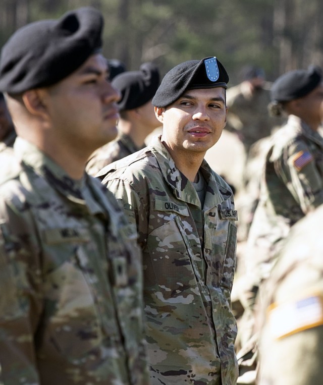 Pvt. Kenny Oliver, a trainee with 1st Battalion, 34th Infantry Regiment, relaxes with his platoon moments before the unit's graduation ceremony March 11 at Hilton Field on Fort Jackson. Oliver, who will be going to Advanced Individual Training to...