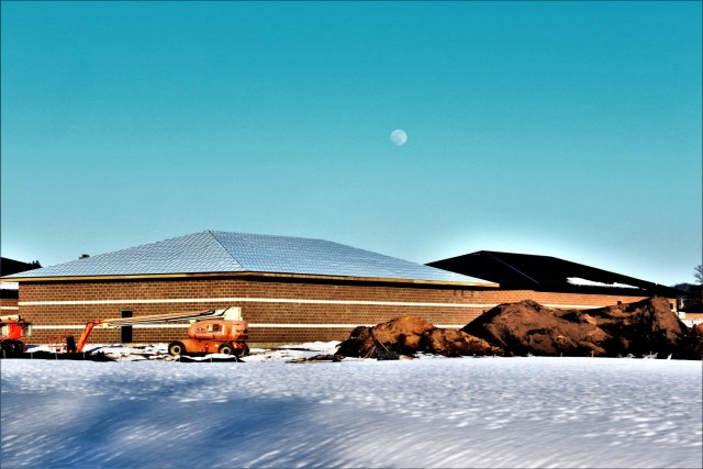 Work on a new simulations building is shown Feb. 25, 2021, in the 200 block of the cantonment area at Fort McCoy, Wis. The construction of this facility is by Contractor MDM Construction Supply of Rockford, Ill. This is the same contractor that has nearly completed five other buildings that began construction in 2019. Once all six new buildings are completed, the simulations training capabilities at Fort McCoy will be more centralized and offer more capability. The simulations training complex is managed by the Fort McCoy Directorate of Plans, Training, Mobilization and Security. The construction project is coordinated by the Fort McCoy Directorate of Public Works. (US. Army Photo by Scott T. Sturkol, Public Affairs Office, Fort McCoy, Wis.)