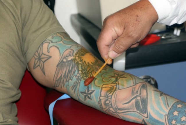 A laboratory technician with the Armed Services Blood Program cleanses the arm in preparation to draw blood from a donor assigned to 5th Armored Brigade, First Army Division West, during a blood drive event on Fort Bliss, Texas, May 16, 2021. Blood drive events are important because they provide quality blood products for service members, veterans and their families in both peace and war. For 5th AR BDE, preparing Soldiers to go into harm’s way isn’t merely a cold, mechanical process; rather, it’s a dedication to individuals’ strengths and needs, focused on achieving the mission. (U.S. Army photo by Staff Sgt. John Onuoha, 5th Armored Brigade)