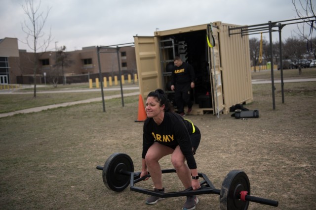 Army MFT, Sgt. 1st Class Aleta Berry, HHC, 13th ESC, trains on her deadlift technique in preparation for the Army Combat Fitness Test March 9.  As an MFT, Berry trained in all aspects of the Army’s physical readiness program which enables them to monitor unit and individual physical readiness programs, and advise command teams on physical readiness issues and improvement programs. (U.S. Army photo by Sgt. 1st Class Kelvin Ringold)