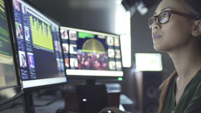 Civilian employee looking at computer screen
