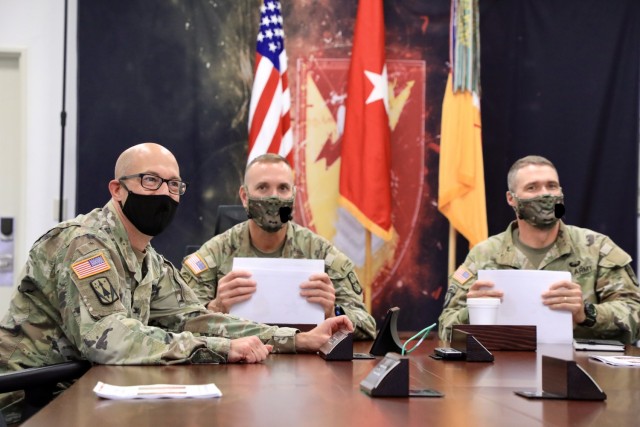 From left to right, Col. Matthew W. Dalton, 38th Air Defense Artillery Brigade commander; Brig. Gen. Mark A. Holler, commanding general, 94th Army Air and Missile Defense Command; and Command Sgt. Maj. Neil H. Sartain, 94th AAMDC senior enlisted advisor; lead a division-level training meeting at Sagami General Depot prior to the commencement of Combined Command Post Training, March 2. The 38th ADA participated in the 94th AAMDC CCPT for the first time to rehearse aspects of planning, intelligence, and execution of defense plans through a two-week training period at Yokota Air Base.
