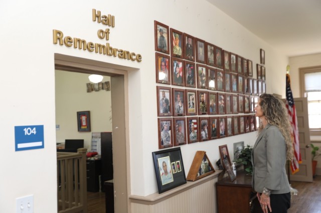 Counselor Pamela Thomas reflects in the Hall of Remembrance at the Fort Bliss Survivor Outreach Services office at Fort Bliss, Texas, March 19, 2021.