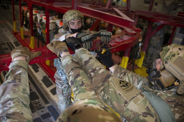 Ft. Bragg Army test paratroopers check leading edge possible T-11 parachute replacements
