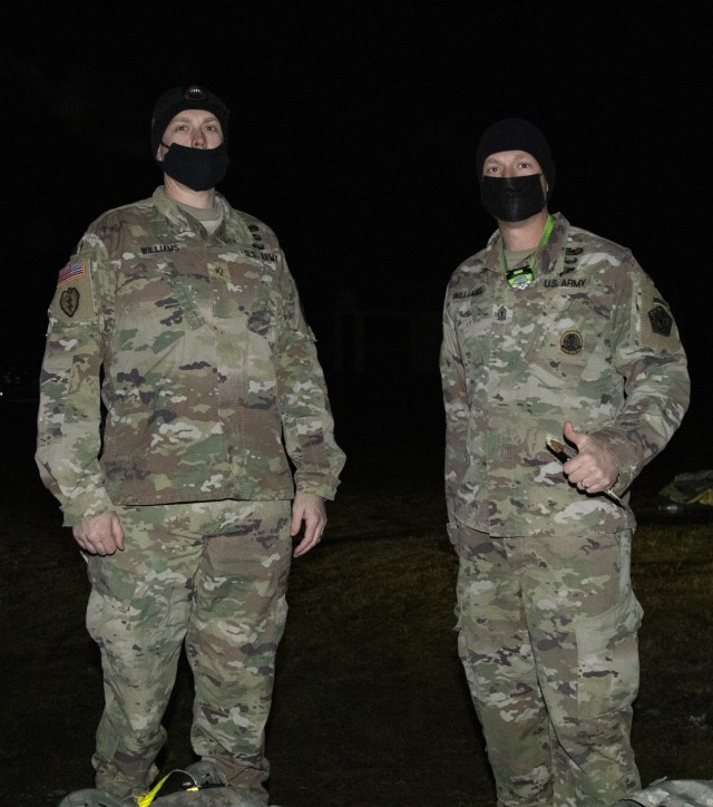 Maj. Trevor Williams, a brigade fire support officer with 1st Battalion, 37th Field Artillery Regiment, 1-2 Stryker Brigade Combat Team (left), and his brother, 1st Sgt. Joshua Williams, 571st Sapper Company, 864th Engineer Battalion, 555th Engineer Brigade, pose for a photo prior to the Norwegian Foot March on Joint Base Lewis-McChord, Wash., Mar. 19, 2021. Although serving in different units, JBLM is the first duty station these brothers have shared after each has served more than ten years. 1st Sgt. Williams said, “I am thankful for the opportunity to participate in this unique event with my brother and a few hundred great American Soldiers.” (U.S. Army photo by Spc. Richard Carlisi)