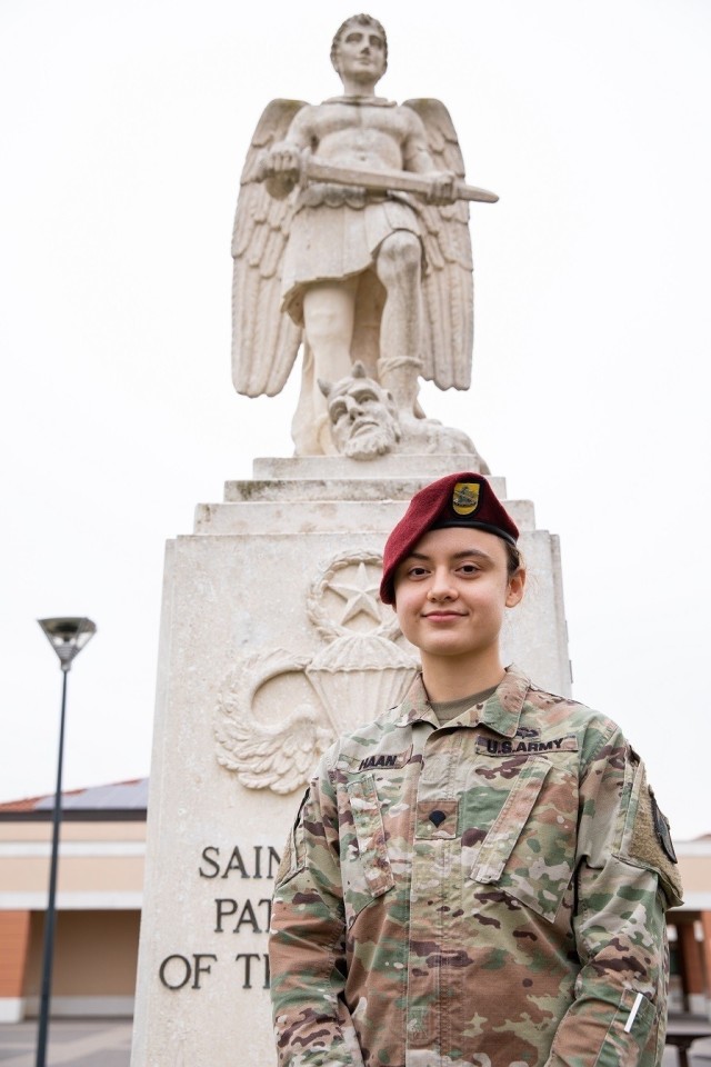 Spc. Rachel Haan, combat medic assigned to the 173rd Brigade Support Battalion (Airborne), 173rd Airborne Brigade, located on Caserma Del Din in Vicenza, Italy, poses in front of the statue of St. Michael, patron saint of the paratroopers. Italy has been her first overseas assignment since she joined the Army in March 2020. (U.S. Army photo by Staff Sgt. Jacob Sawyer).