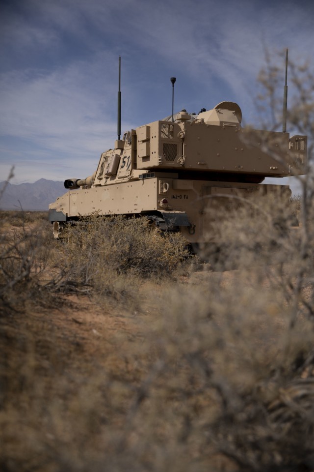 U.S. Army Soldiers assigned to 2nd Battalion, 3rd Field Artillery Regiment, 1st Armored Brigade Combat Team, 1st Armored Division, wait inside their M109 Paladin for orders to fire during a battalion level field training exercise at the Dona Ana...