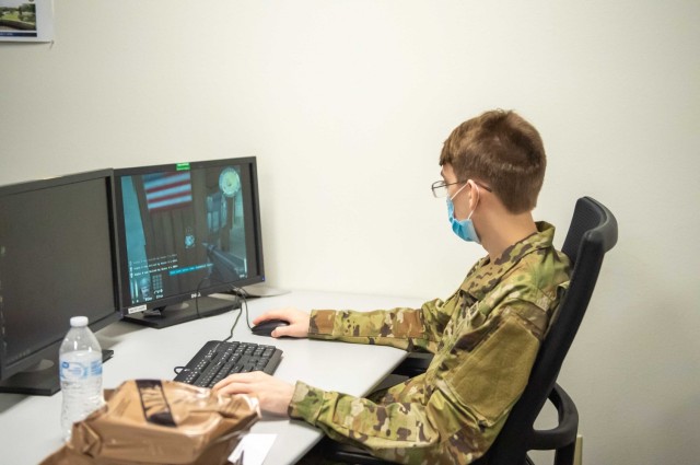 Pvt. Jeffery Abbot, an RSP recruit awaiting basic training, plays Wolfenstein, an older computer video game that the military used to teach tactics, during the Interactive War Games cyber recruiting drive beta test March 13, 2020 at Robinson...