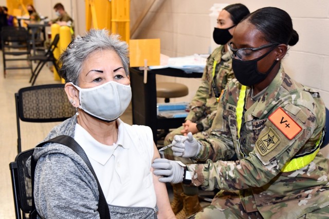 68C Practical Nursing Specialist student Pfc. Renecia Miller-Clark, assigned to the 264th Medical Battalion, 32nd Medical Brigade, MEDCoE, is assisting the Brooke Army Medical Center by administering the COVID-19 vaccine to a patient. Along with other 68C nursing students, Pfc. Miller-Clark completed Phase 1 of her Advanced Individual Training and is assisting BAMC while awaiting to complete Phase II of her training at the William Beaumont Army Medical Center at Fort Bliss, TX.