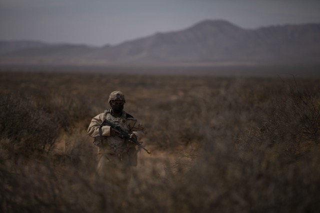 Pfc. Herman Lloyd, a U.S. Army Soldier assigned to 2nd Battalion, 3rd Field Artillery Regiment, 1st Armored Brigade Combat Team, 1st Armored Division, conducts a perimeter sweep during a battalion level field training exercise at the Dona Ana...