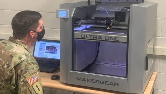 Chief Warrant Officer 2 James Giles, an Allied Trades Warrant Officer (914A) attending the Warrant Officer Advanced Course, manufactures a part on a 3D printer located in Cohen Hall, U.S. Army Ordnance School, Fort Lee, Virginia.
