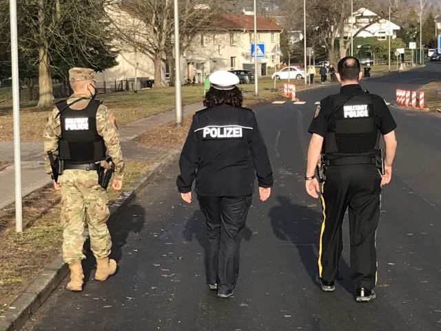 WIESBADEN, Germany - U.S. Army Garrison Wiesbaden Military Police officers and a member of the German Polizei patrol the streets of an off-post housing area.