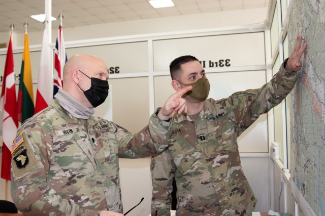 Capt. Mathew Bisesto, Lead Project Developer of the Area Development Plan, and Lt. Col. Jeremy Irvin, Stakeholder Manager, discuss the location of some facility improvements at Combat Training Center-Yavoriv. (U.S. Army photo by Maj. Dutch Grove)