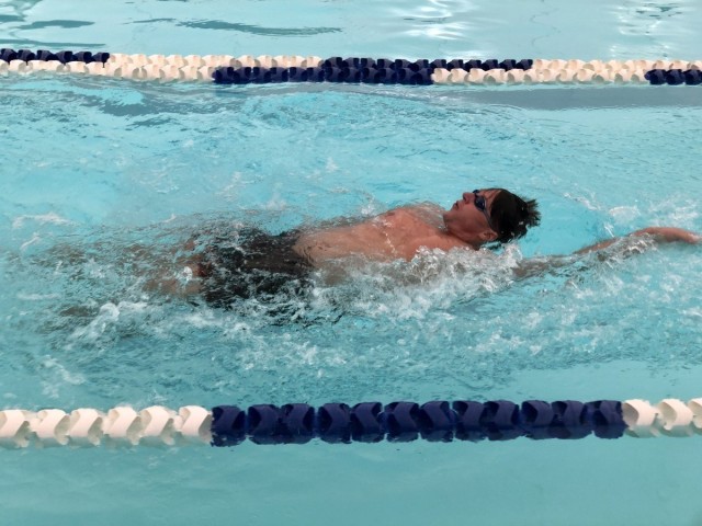 Sgt. Jared Babinski competes in the 50-meter backstroke swimming event. (Photo via Robyn Womac)