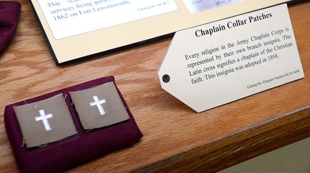 These chaplain collar patches are part of a new exhibit at the Frontier Army Museum highlighting Fort Leavenworth chaplains. The Latin cross, insignia adopted in 1898, signifies a chaplain of the Christian faith. Photo by Prudence Siebert/Fort...