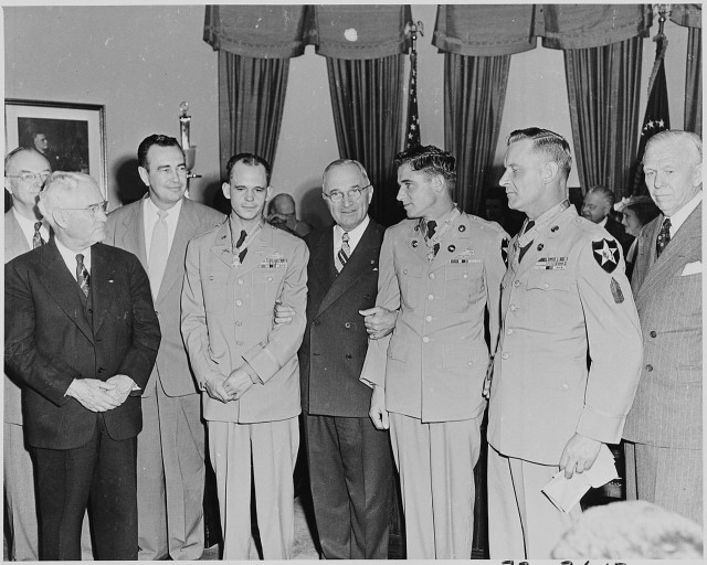 Kouma (in uniform at right) receives his Medal of Honor from President Harry S. Truman.