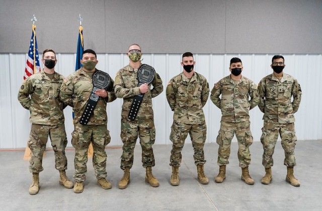 Competitors of the 2021 Kansas Army National Guard Best Warrior Competition pose for a group photo Mar. 21 in Salina, Kansas. From left to right, Sgt. Anthony Bien, 635th Regional Support Group; Sgt. Andrew Gonzales, 1st Battalion, 635th Armor...
