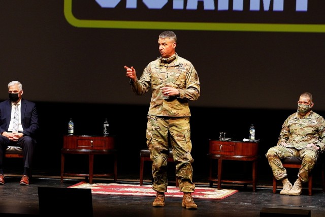 Gen. Joseph M. Martin (center), the 37th vice chief of staff of the Army, answers a question from the audience as Acting Under Secretary of the Army Christopher Lowman (left) and Sgt. Maj. of the Army Michael A. Grinston (right) listen in the...