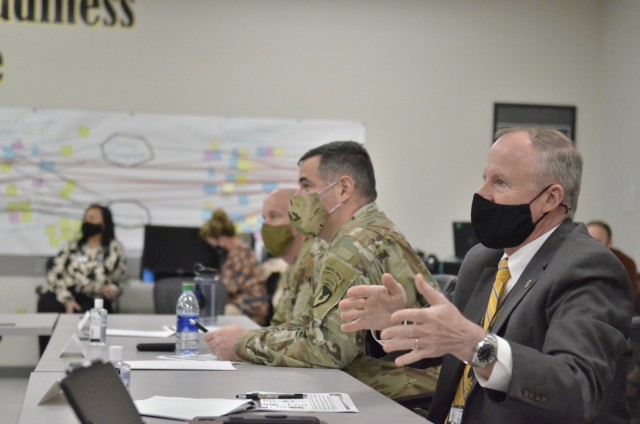 Colonel Jeremy D. Bell, Fort Campbell garrison commander, and Jonathan Hunter, Fort Campbell deputy garrison commander, offer feedback on the Leadership Fort Campbell 2.0 cohort’s presentation March 18 at the Garrison Learning Center.
